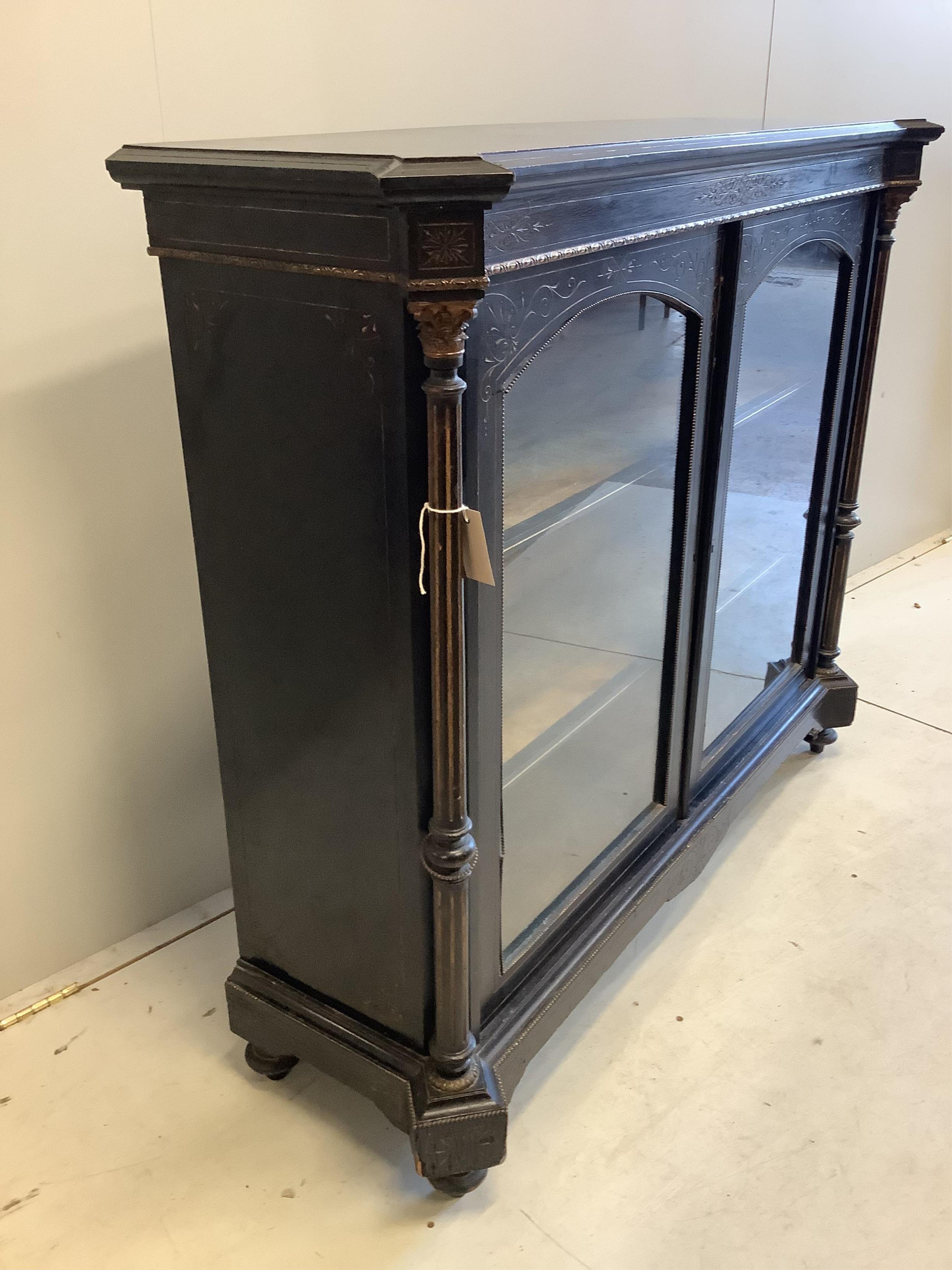 A late Victorian gilt metal mounted ebonised pier cabinet, width 124cm, depth 39cm, height 106cm. Condition - fair